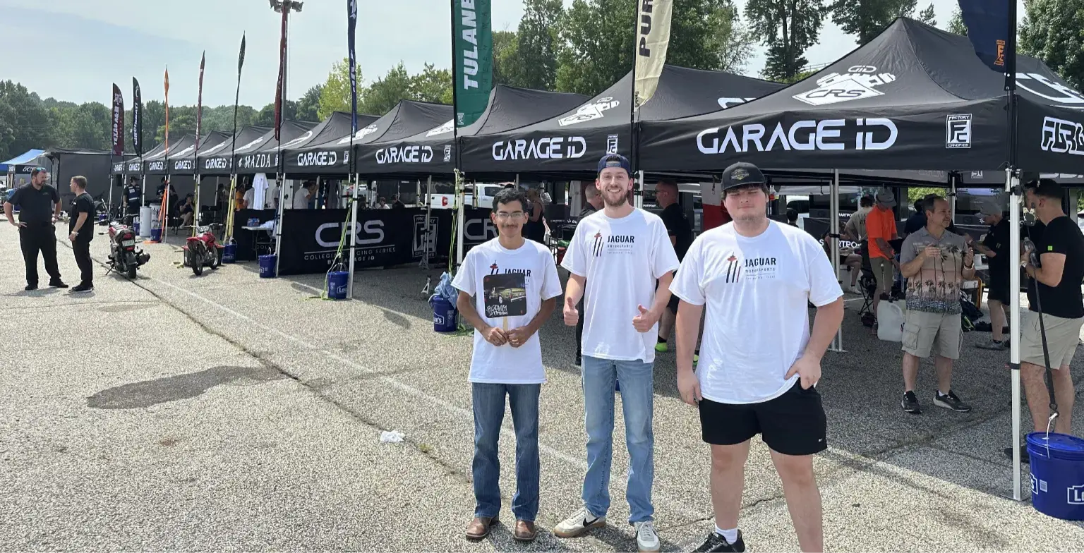 Jaguar Motorsports members representing the team at the racing paddock